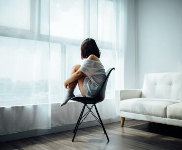girl sitting alone